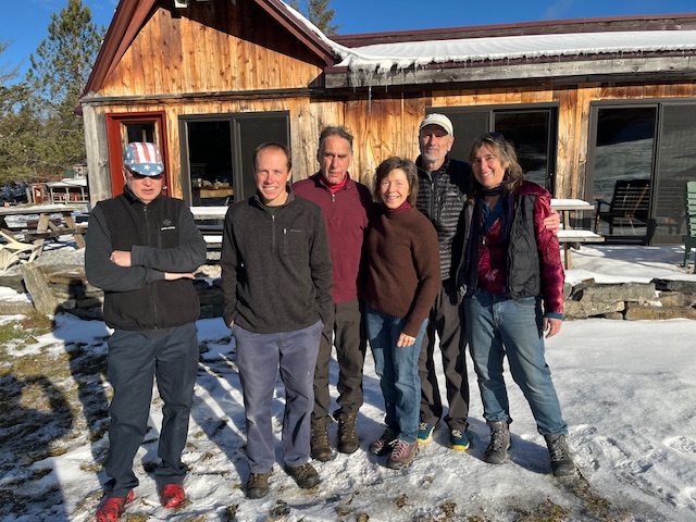 2025-26 staff in front of the lodge